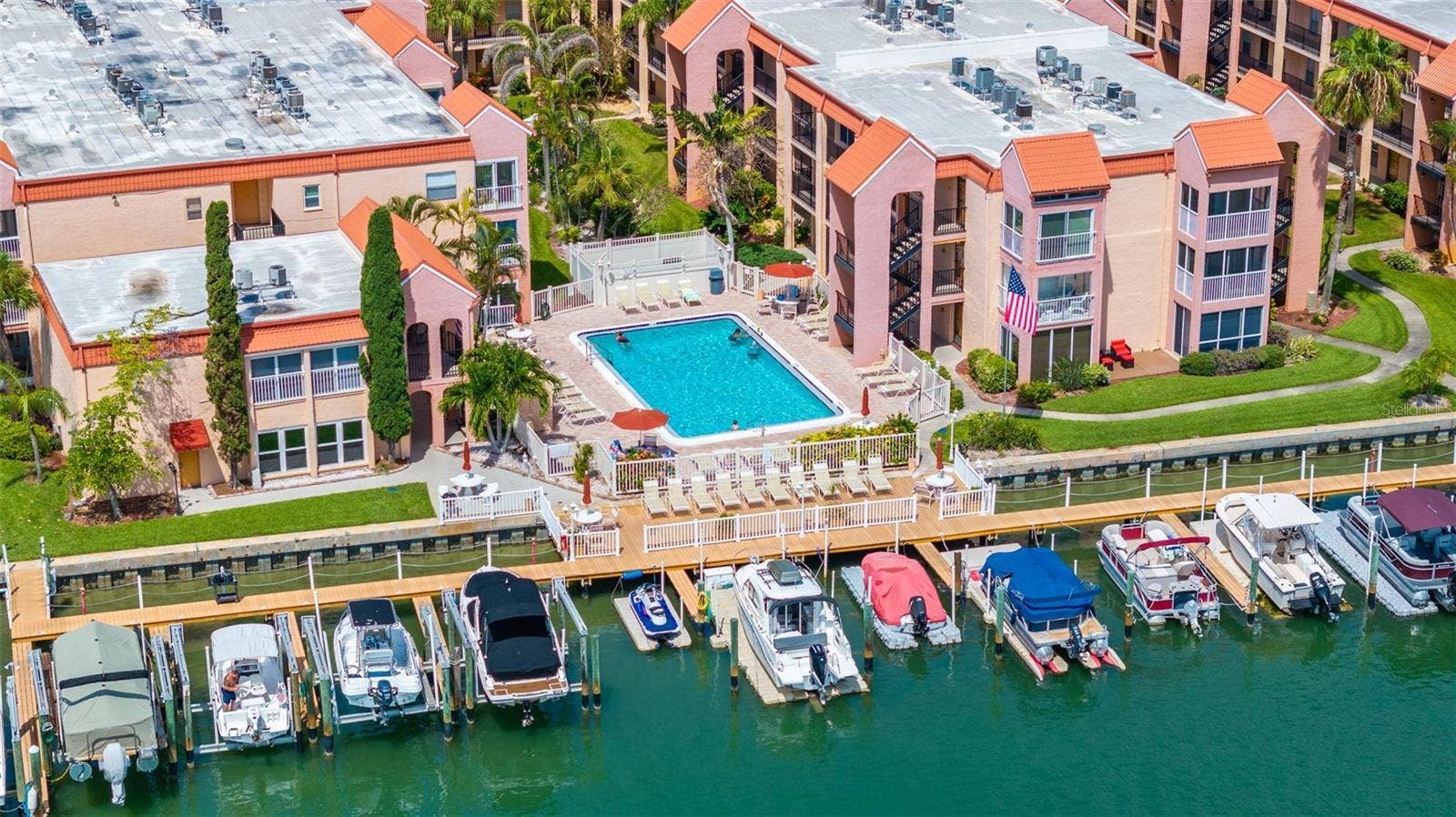 8921 BLIND PASS ROAD, #250, St Pete Beach, FL 33706 aerial view of deck and pool
