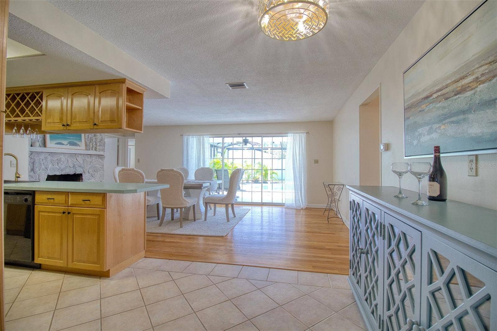 Through kitchen and sliders to pool