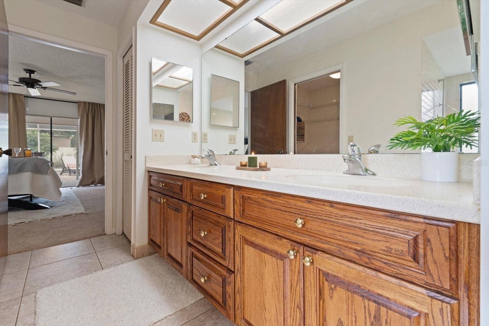 1105 DEER RUN PLACE, Valrico, FL 33594 Dual vanities, large walk-in closet and all the character make this ensuite one-of-a-kind!
