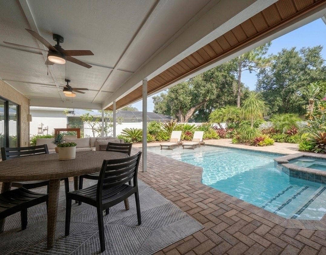 1105 DEER RUN PLACE, Valrico, FL 33594 Looking out from the patio at a virtually staged pool concept for the backyard.