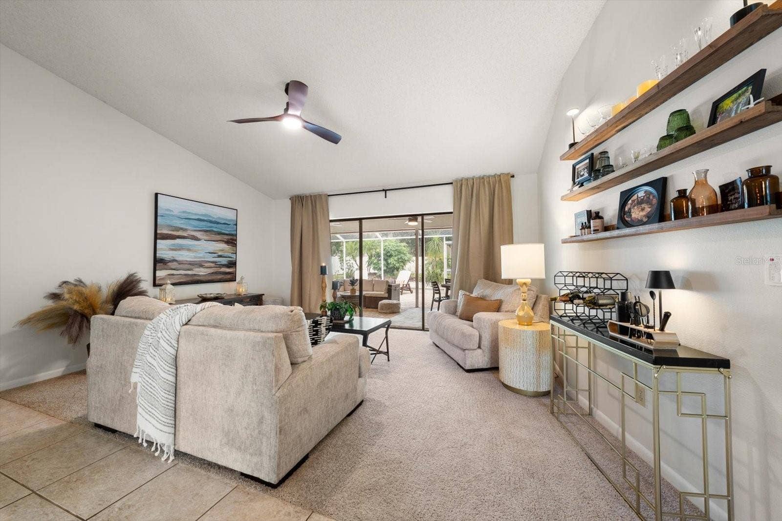 1105 DEER RUN PLACE, Valrico, FL 33594 Formal living spaces have a panoramic view of the paved and covered lanai.