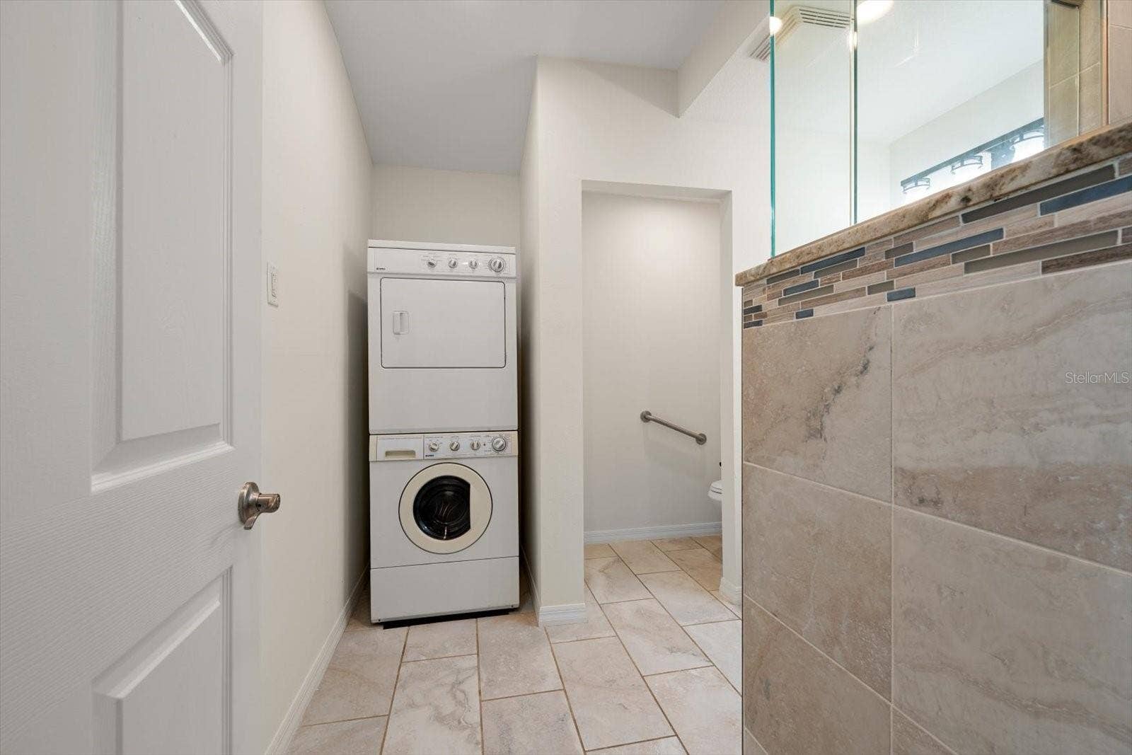 1105 DEER RUN PLACE, Valrico, FL 33594 Private laundry and water closet complete the perfect ADU experience!