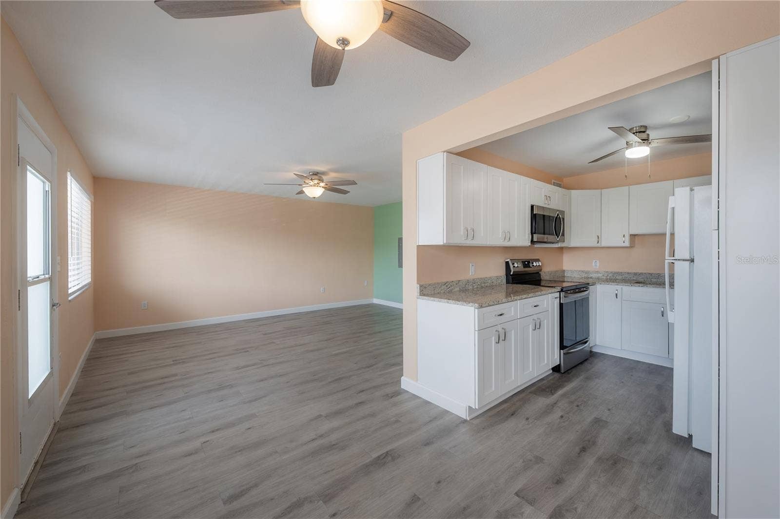 8055 112TH STREET, #205, Seminole, FL 33772 Dining area facing living area and kitchen
