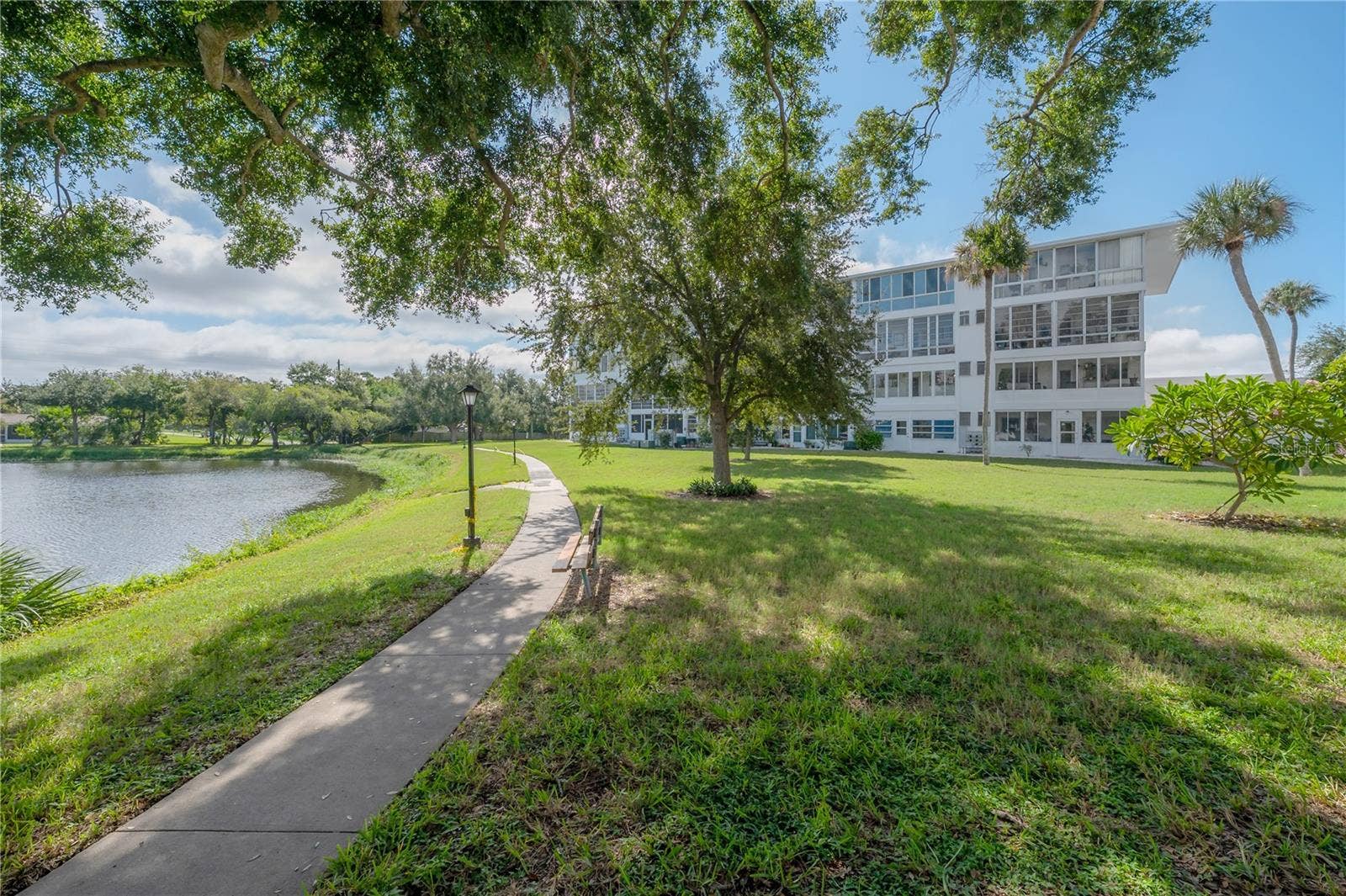 8055 112TH STREET, #205, Seminole, FL 33772 View of lake facing the building
