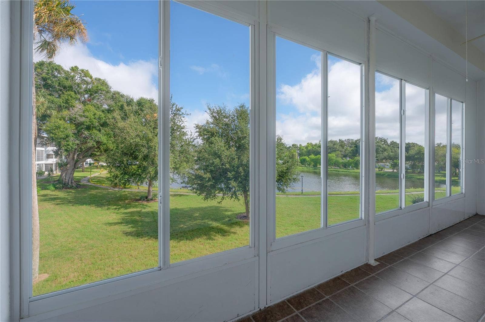 8055 112TH STREET, #205, Seminole, FL 33772 Lanai with view of lake