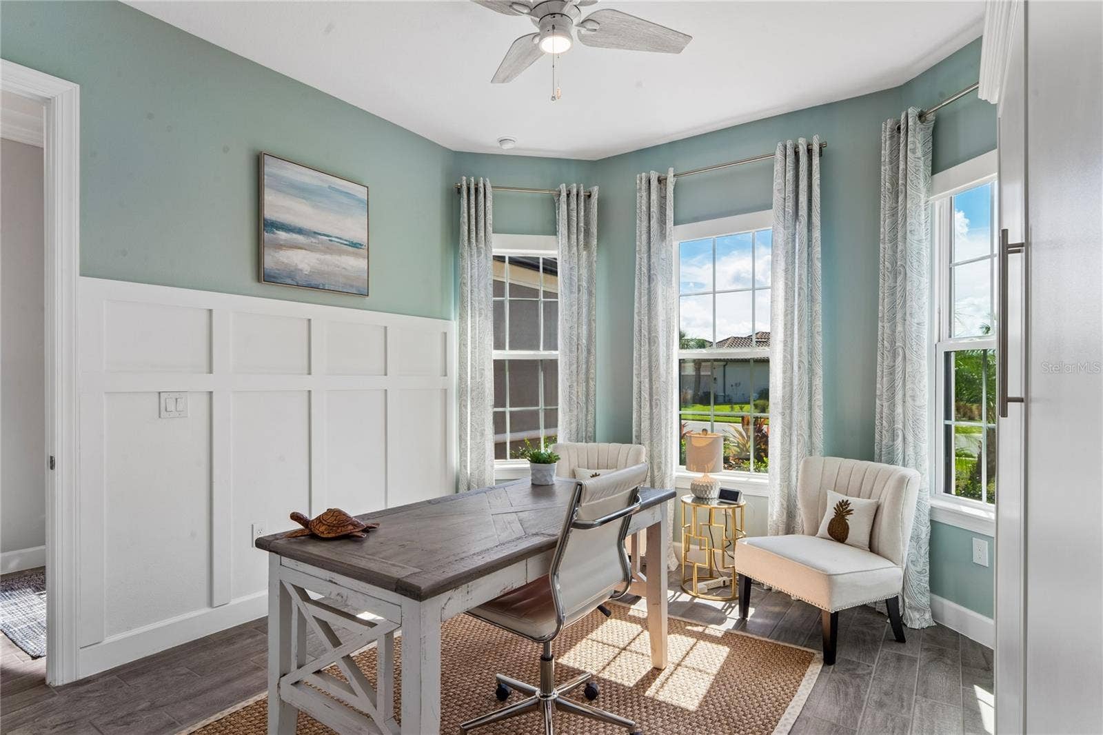 Bedroom 2- wainscoting on wall and bay window