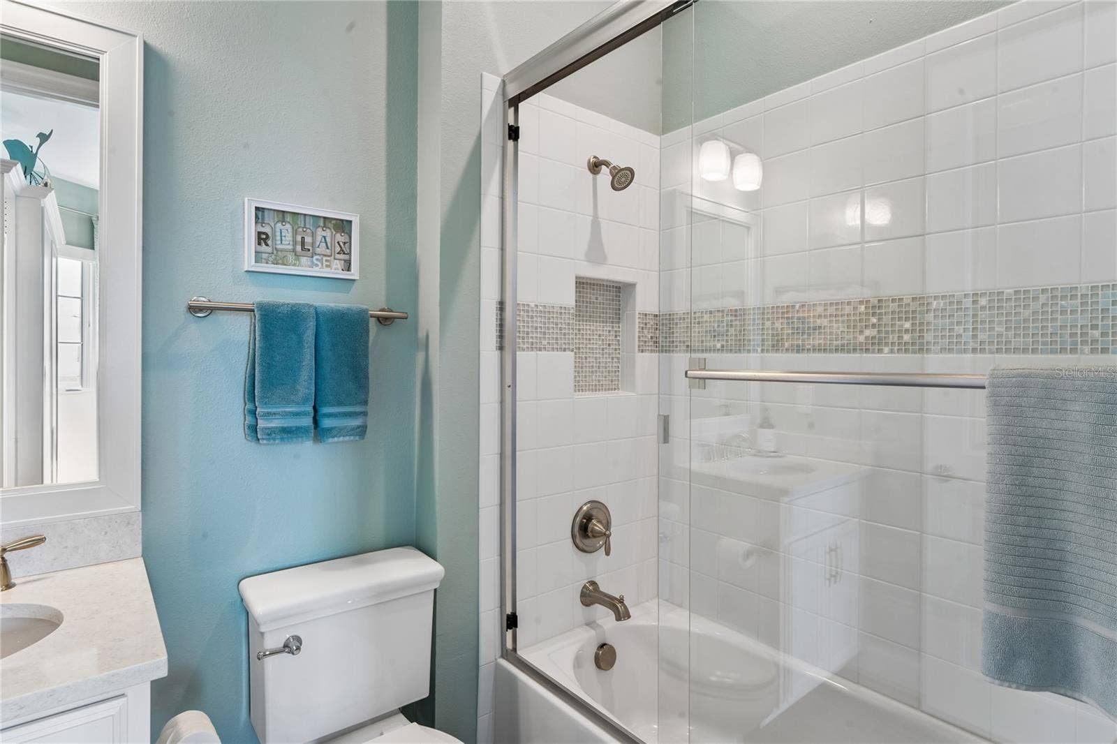 Bedroom 2 -en-suite bathroom w/ tub and glass shower doors