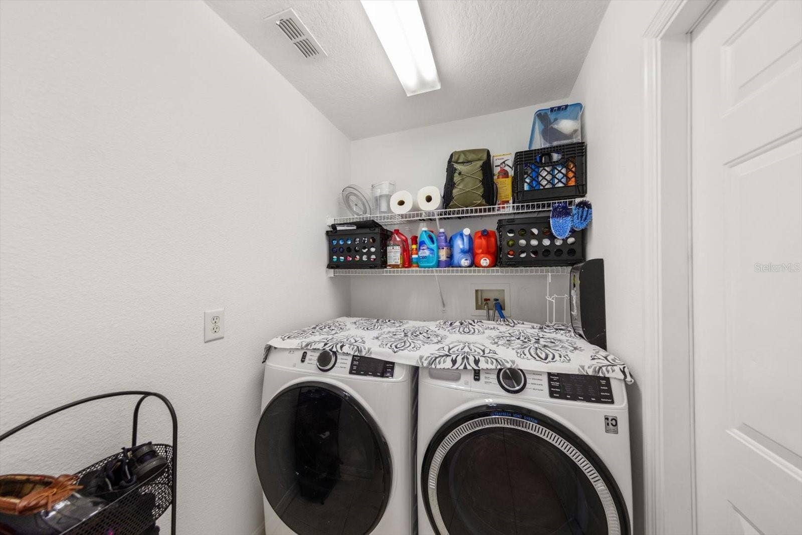 Inside laundry room with door out to the garage