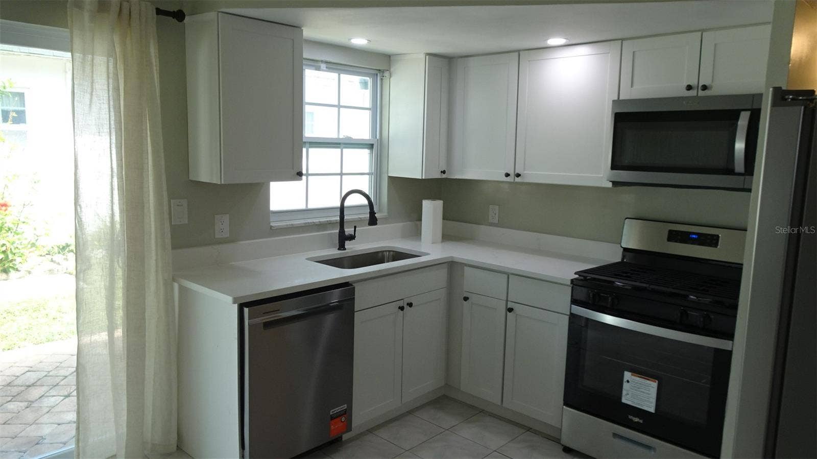 7809 38TH TERRACE N, St Petersburg, FL 33709 Natural light from the north facing window and door.