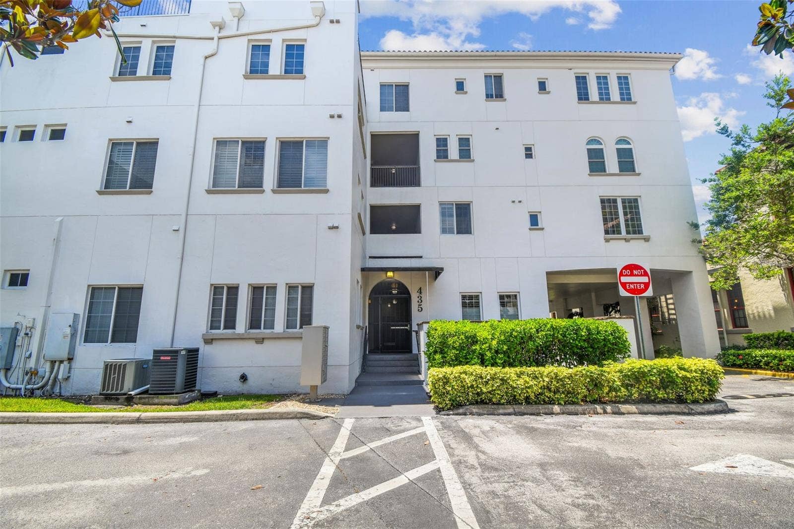 Rear view of condo building from the covered parking area.