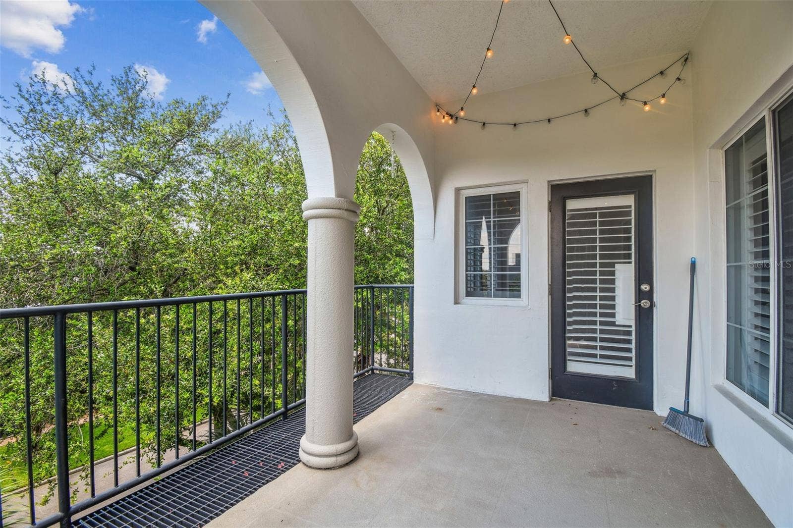 435 S OREGON AVENUE E, #304, Tampa, FL 33606 Enclosed outdoor patio overlooking tree-lined street.