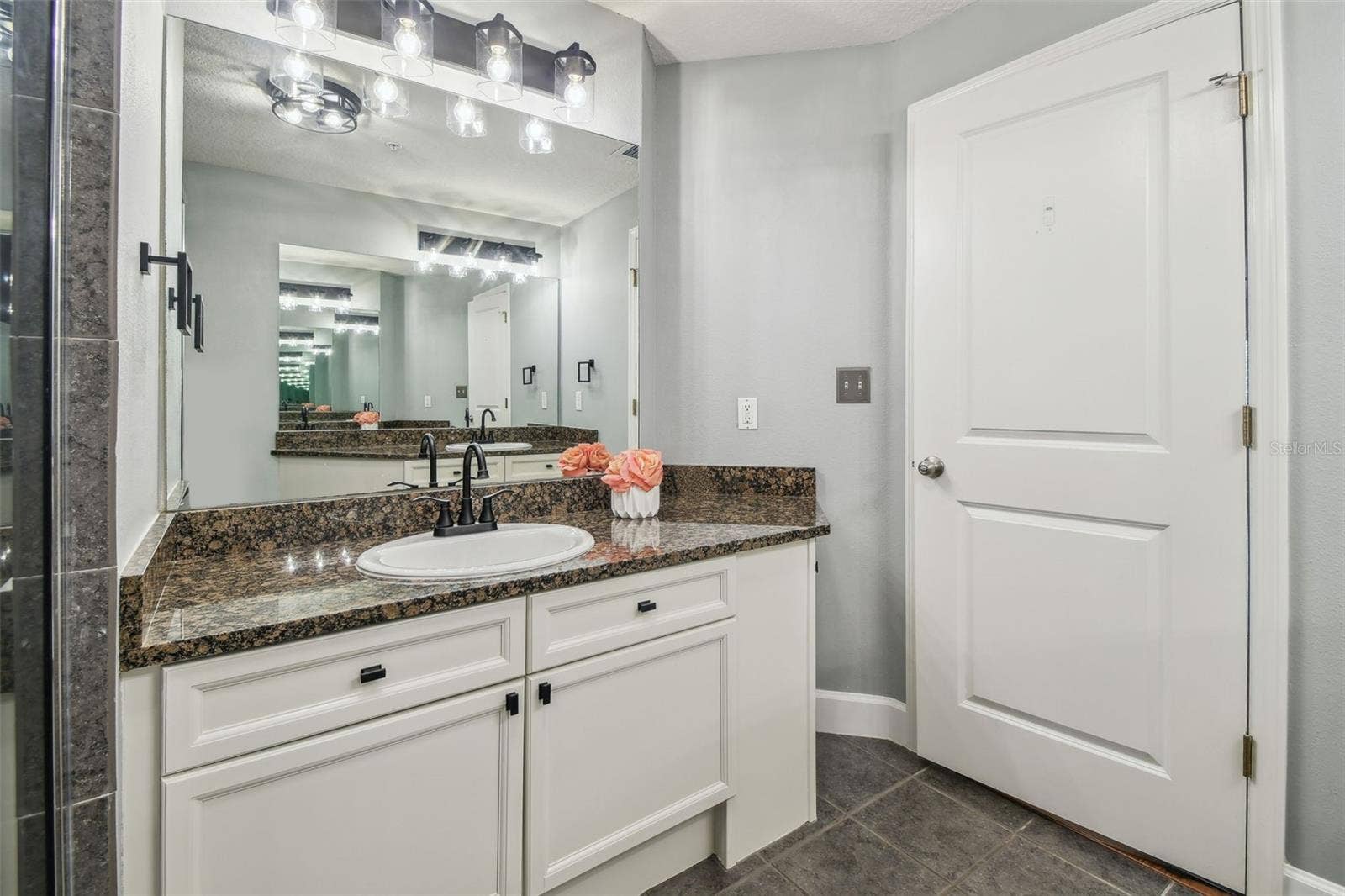 435 S OREGON AVENUE E, #304, Tampa, FL 33606 Primary bathroom with dual vanities.