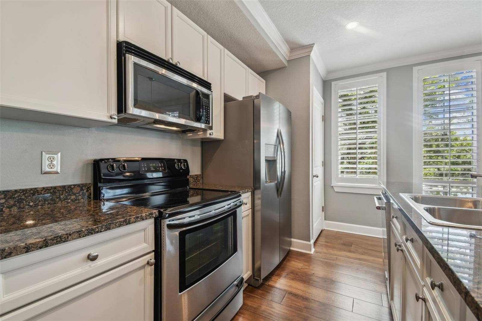 435 S OREGON AVENUE E, #304, Tampa, FL 33606 Kitchen featuring stainless steel appliances, and stone countertops.