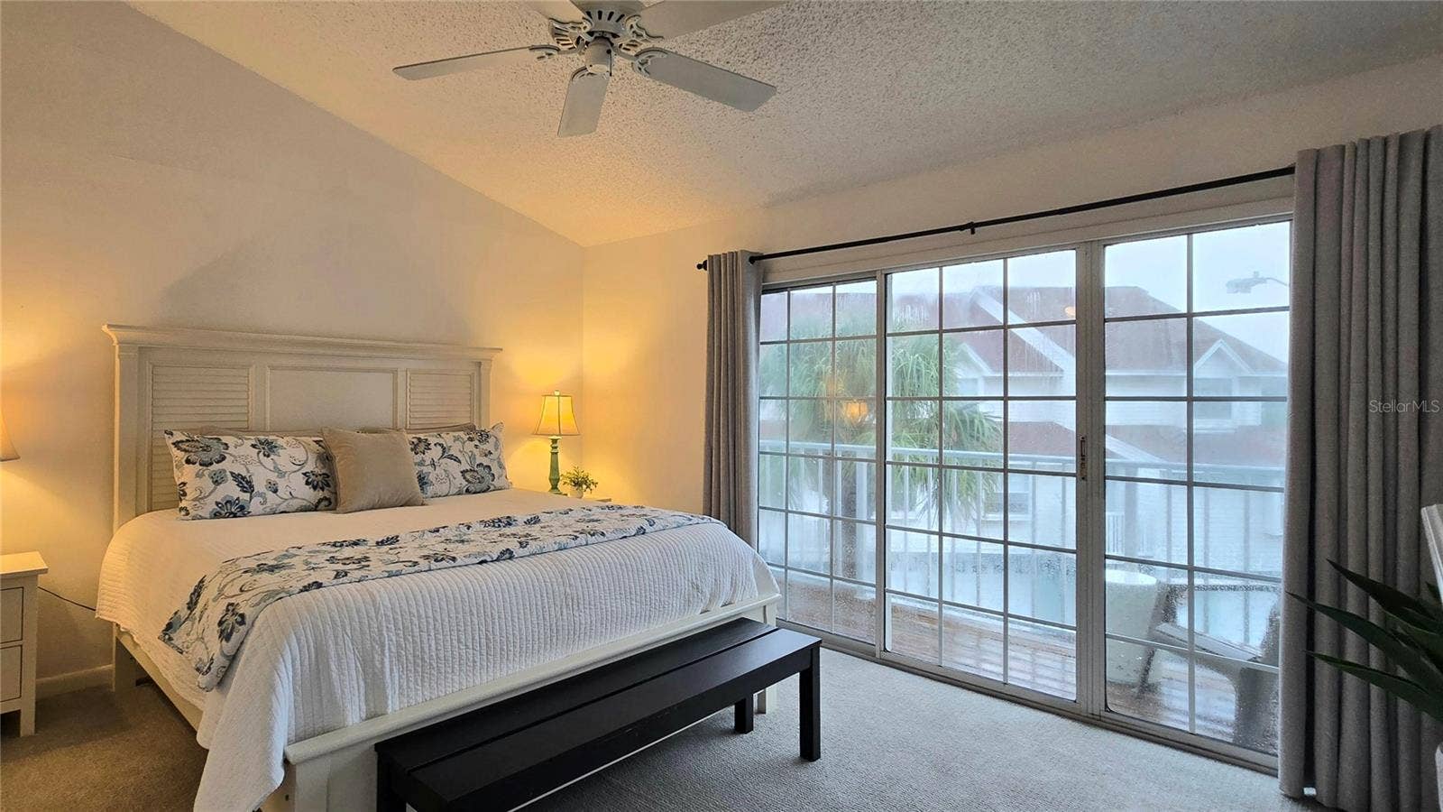 Primary Suite with sliding doors to a Private Balcony with Water View.