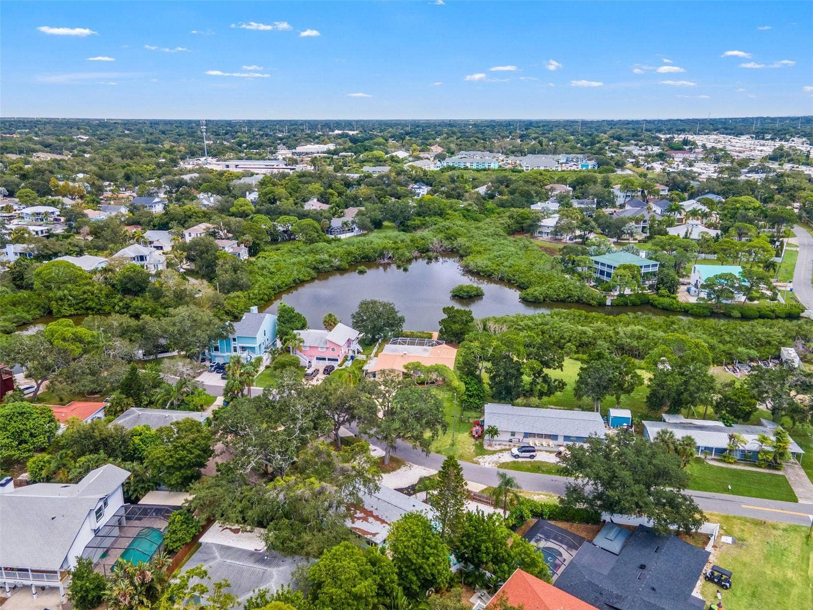 201 SOUTH STREET, Palm Harbor, FL 34683 Aerial view of the surrounding Ozona neighborhood, with waterfront homes, natural waterways, and marinas nearby.