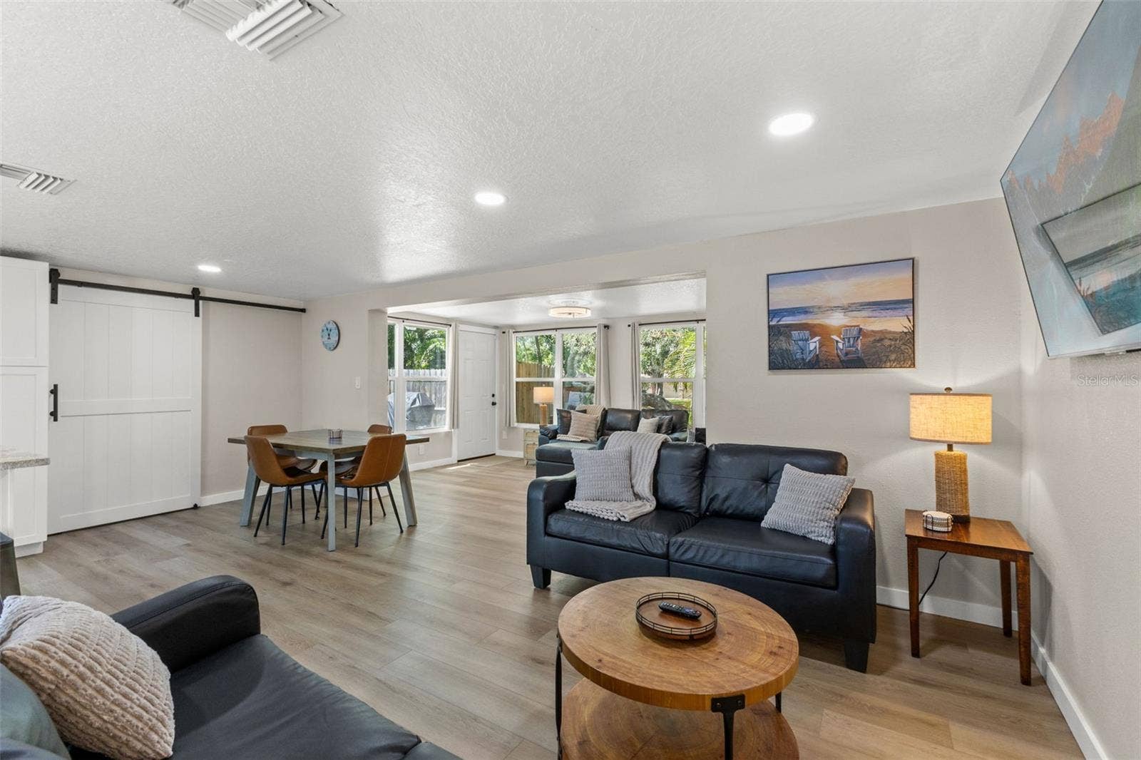 201 SOUTH STREET, Palm Harbor, FL 34683 Open dining and living spaces provide plenty of room for everyday living and entertaining.