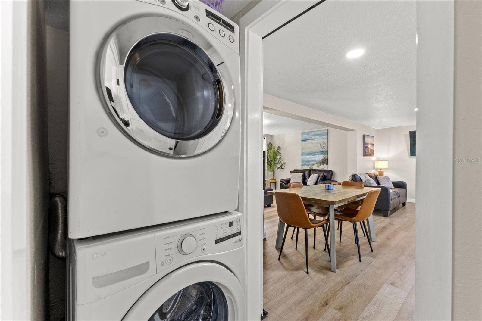 201 SOUTH STREET, Palm Harbor, FL 34683 Convenient interior laundry with a full-size stacked washer and dryer just off the main living and dining areas.