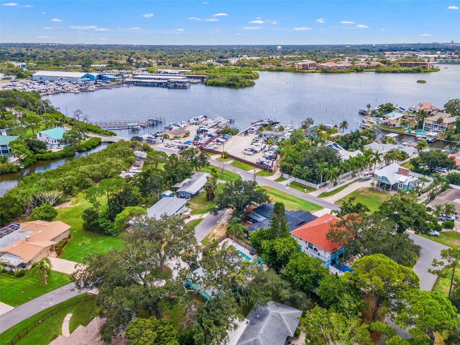 201 SOUTH STREET, Palm Harbor, FL 34683 Aerial perspective highlights just how close the home is to local marinas and the waterfront lifestyle Ozona is known for.