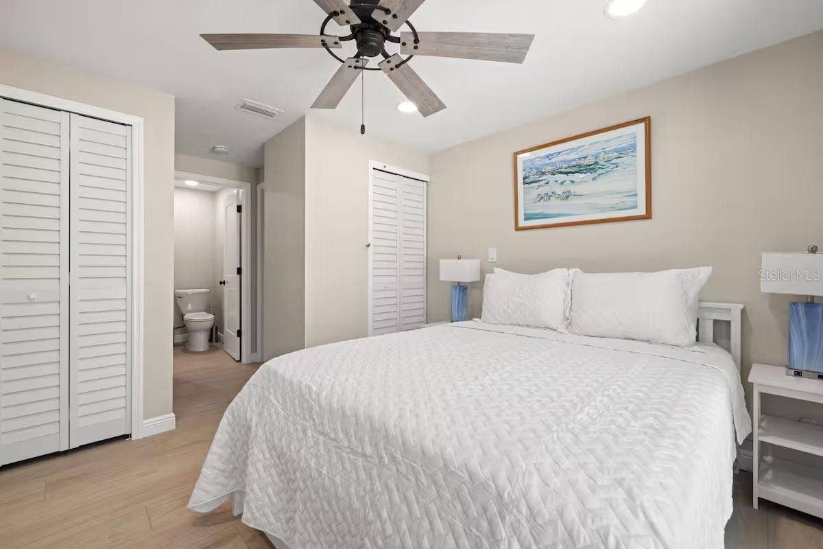 201 SOUTH STREET, Palm Harbor, FL 34683 Another view of the primary suite highlights TWO CLOSETS and convenient access to the ensuite bath.