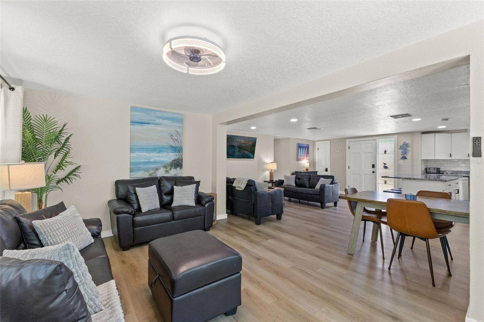 201 SOUTH STREET, Palm Harbor, FL 34683 The open floor plan provides multiple gathering spaces with luxury vinyl plank flooring throughoutno carpet.