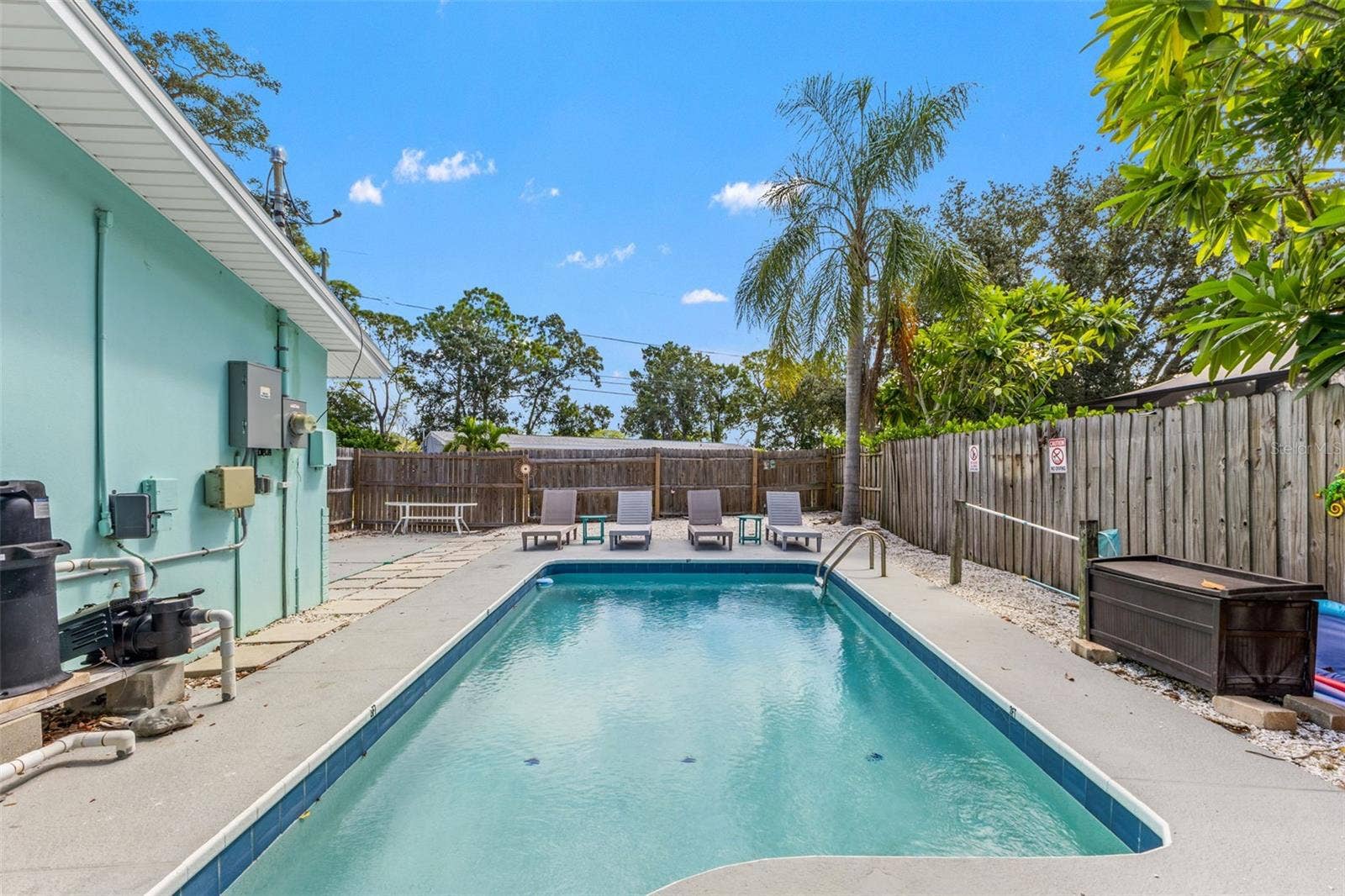 201 SOUTH STREET, Palm Harbor, FL 34683 Spacious pool area with plenty of room for lounge chairs, outdoor seating, and entertaining.