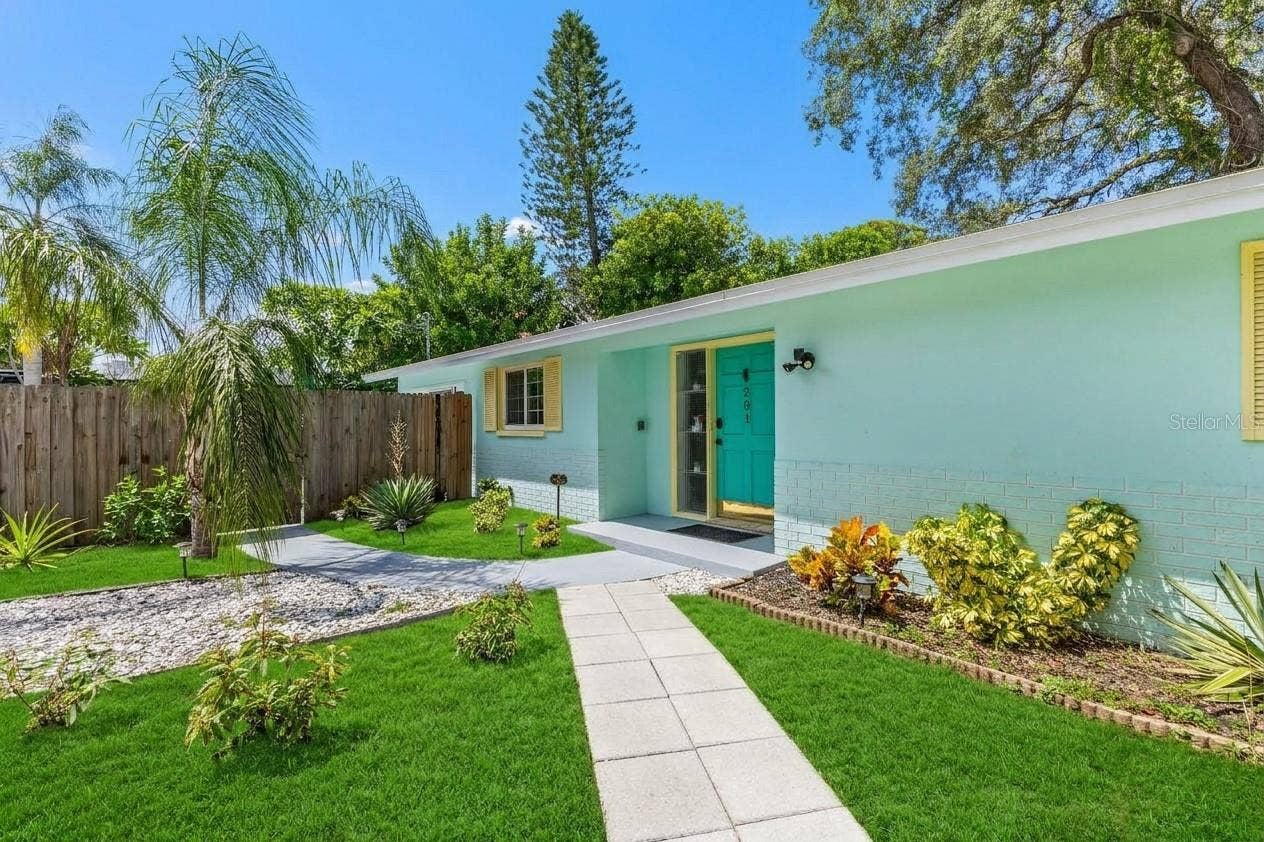 201 SOUTH STREET, Palm Harbor, FL 34683 Charming Ozona cottage with a circular drive, refreshed landscaping, and plenty of room surrounding the home.