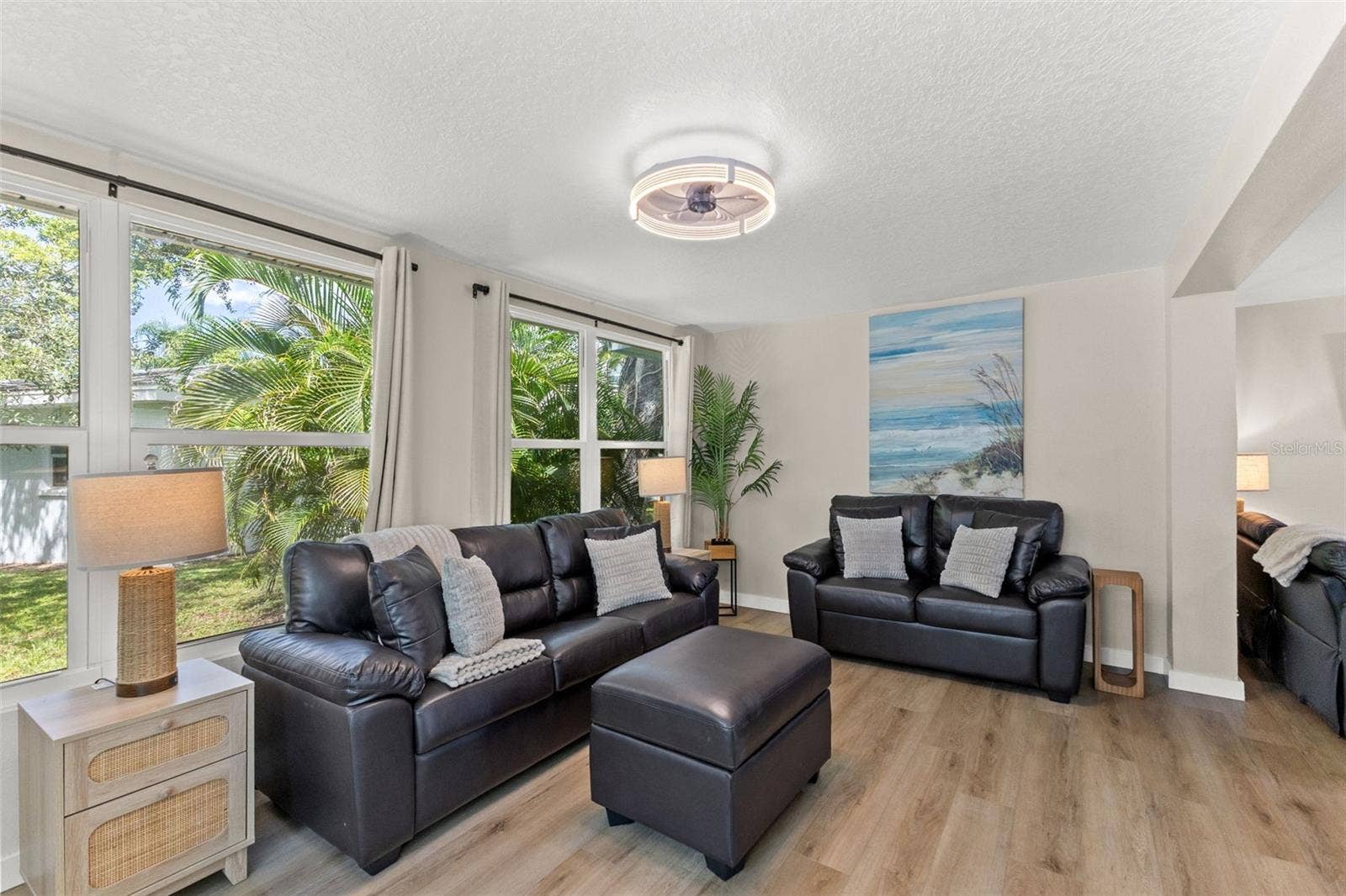 201 SOUTH STREET, Palm Harbor, FL 34683 The homes single-story layout offers generous, connected living spaces with updated flooring and a bright, neutral interior.