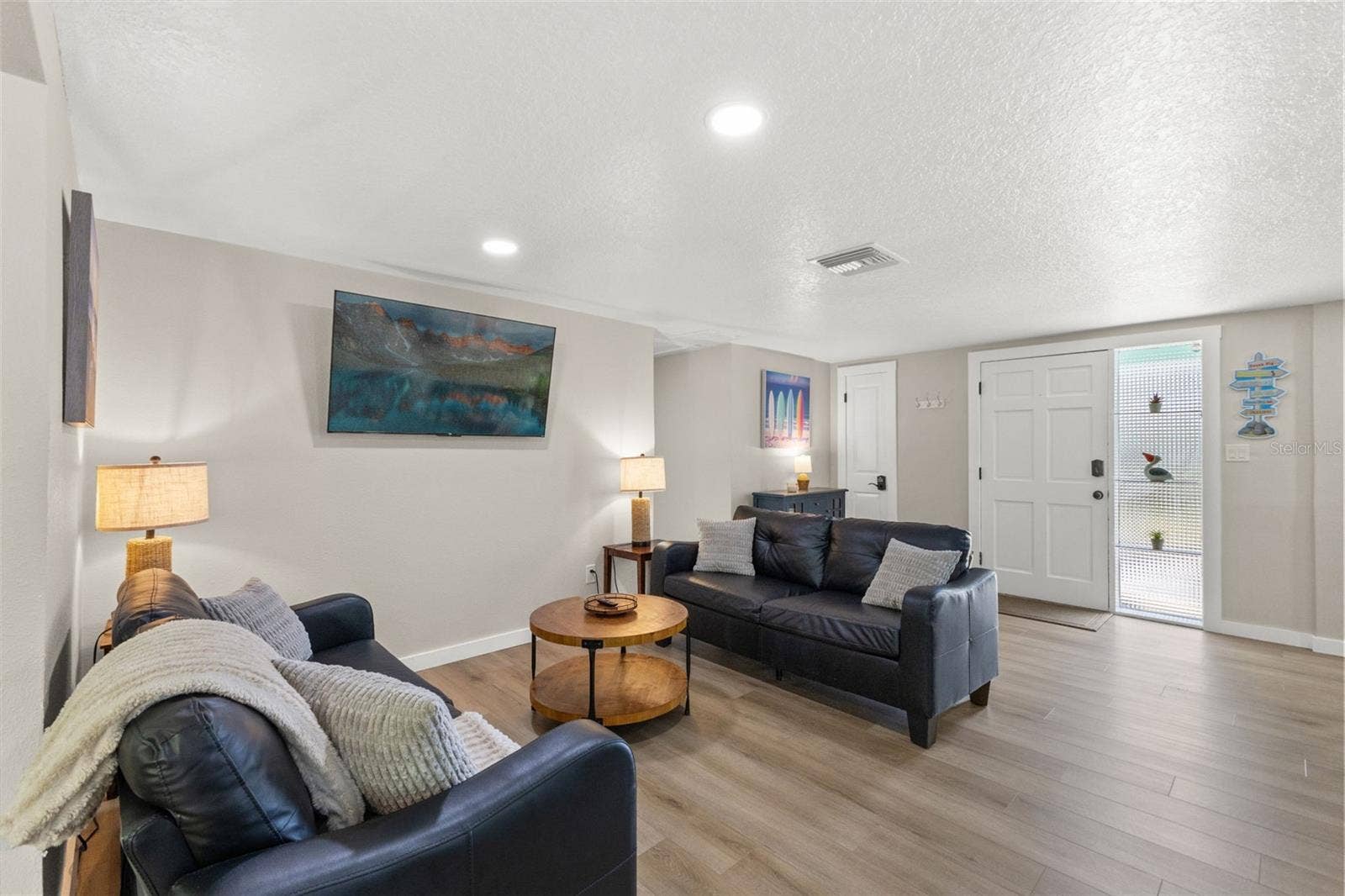 201 SOUTH STREET, Palm Harbor, FL 34683 A second spacious living area adds flexibility to the 3-bedroom split floor plan and provides another comfortable place to gather.