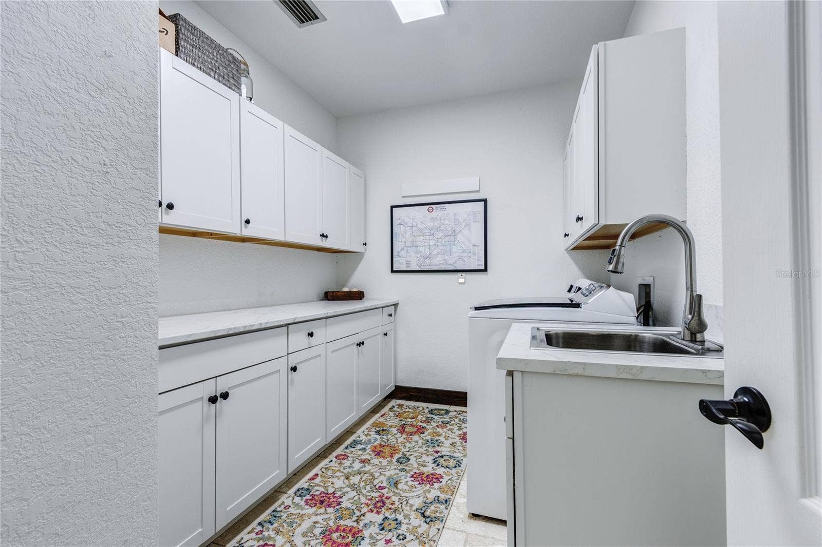 32305 PASCO ROAD, San Antonio, FL 33576 Cabinets galore in laundry room and utility sink!