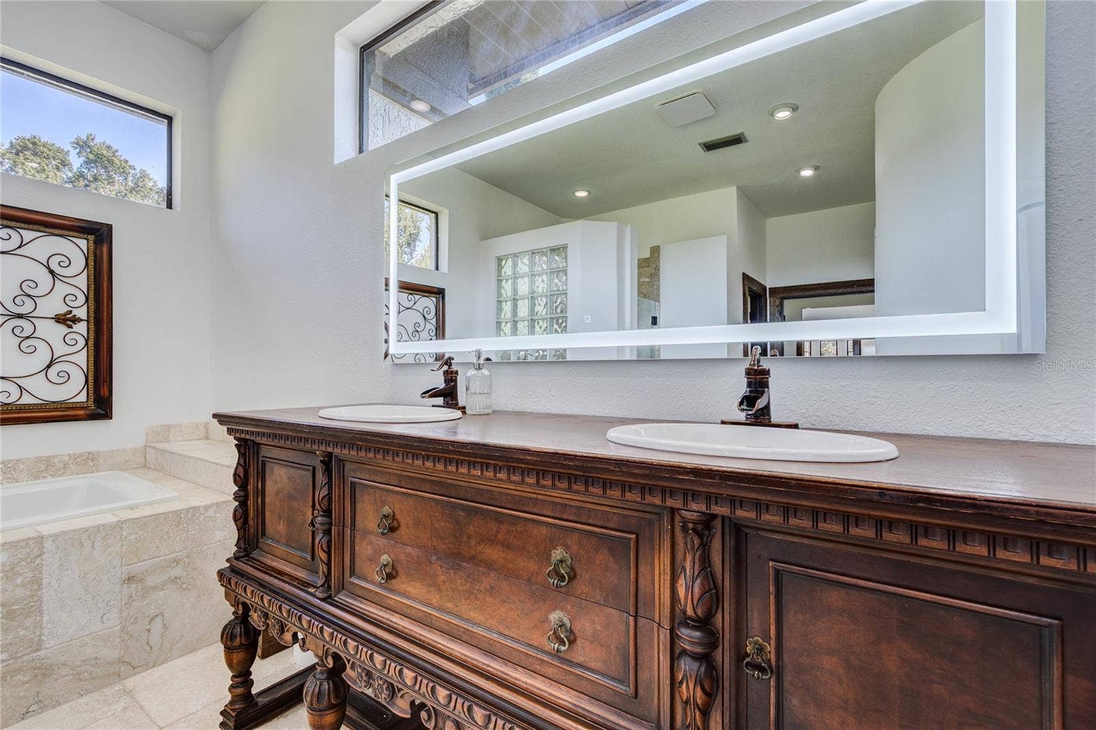 32305 PASCO ROAD, San Antonio, FL 33576 LED Mirror over antique wood vanity!