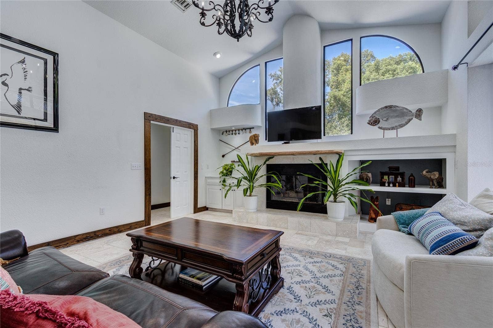 32305 PASCO ROAD, San Antonio, FL 33576 Large family room with oval windows and gas fireplace!
