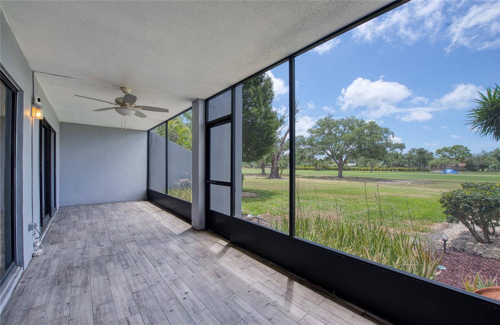 9200 PARK BOULEVARD, #105, Seminole, FL 33777 Screened in expansive patio with outstanding views