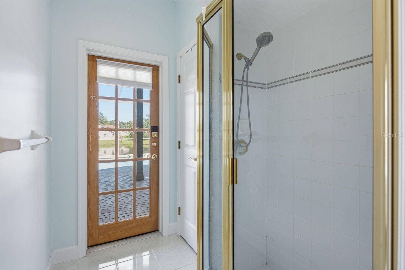 3763 EXECUTIVE DRIVE, Palm Harbor, FL 34685 Shower and door to Lanai