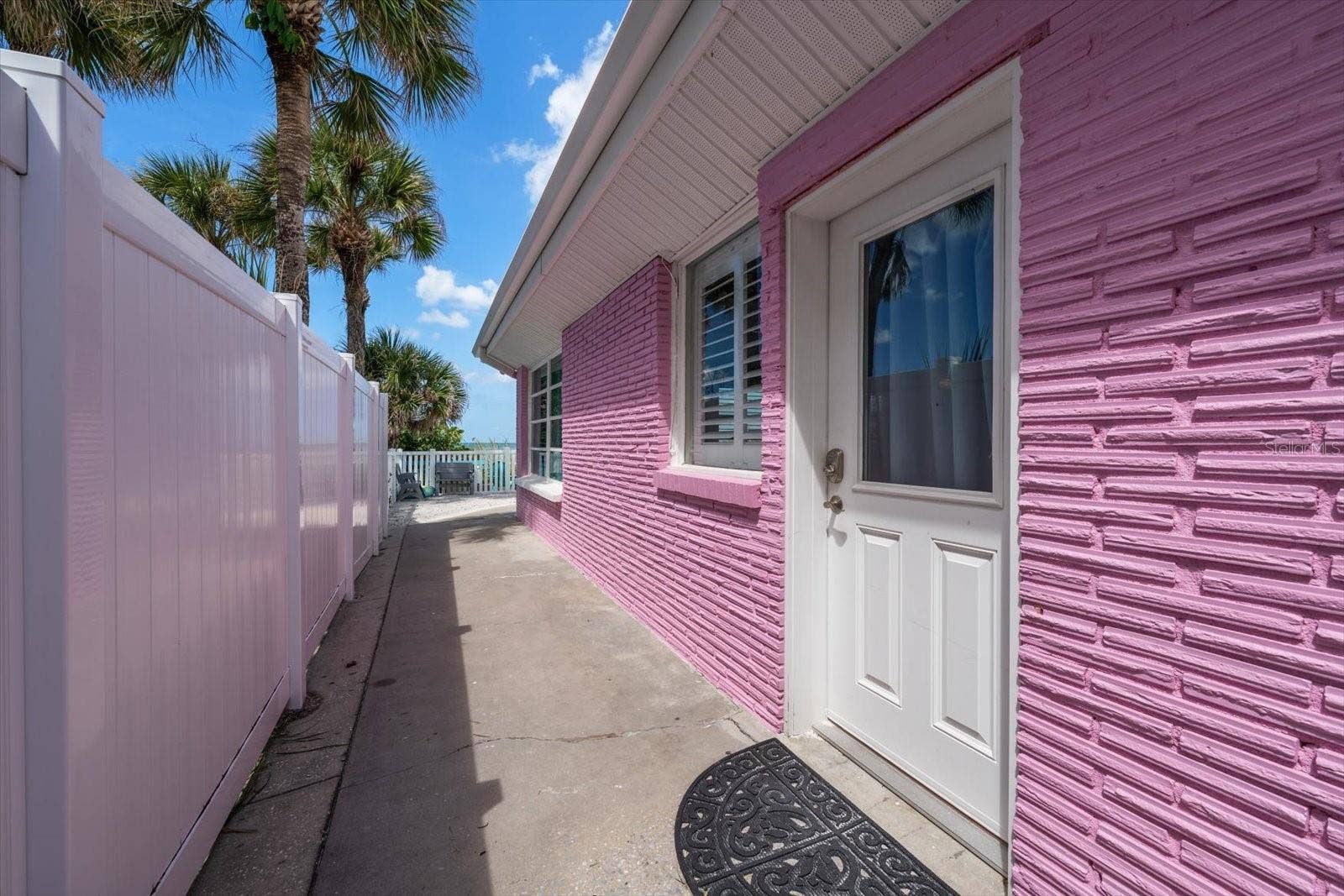 1512 GULF BOULEVARD, Indian Rocks Beach, FL 33785 Main home-side access to main beachside home.
