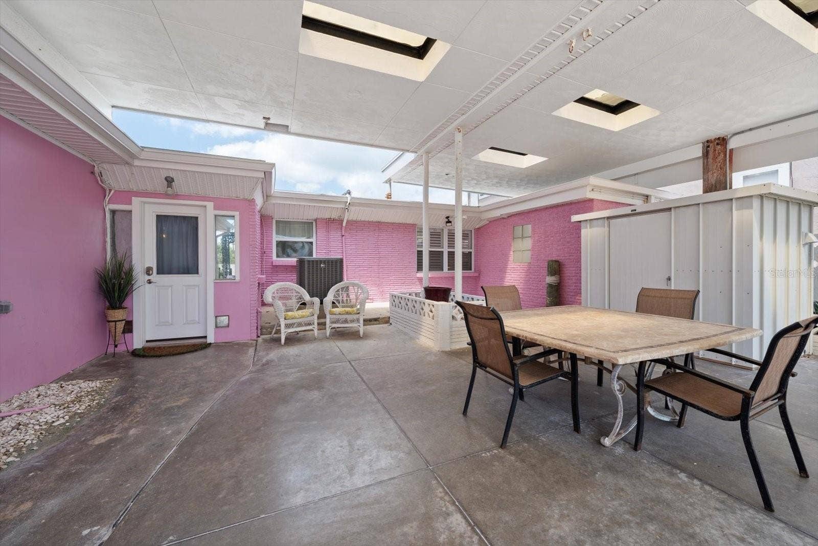 1512 GULF BOULEVARD, Indian Rocks Beach, FL 33785 Exterior patio area between main home and additional units.