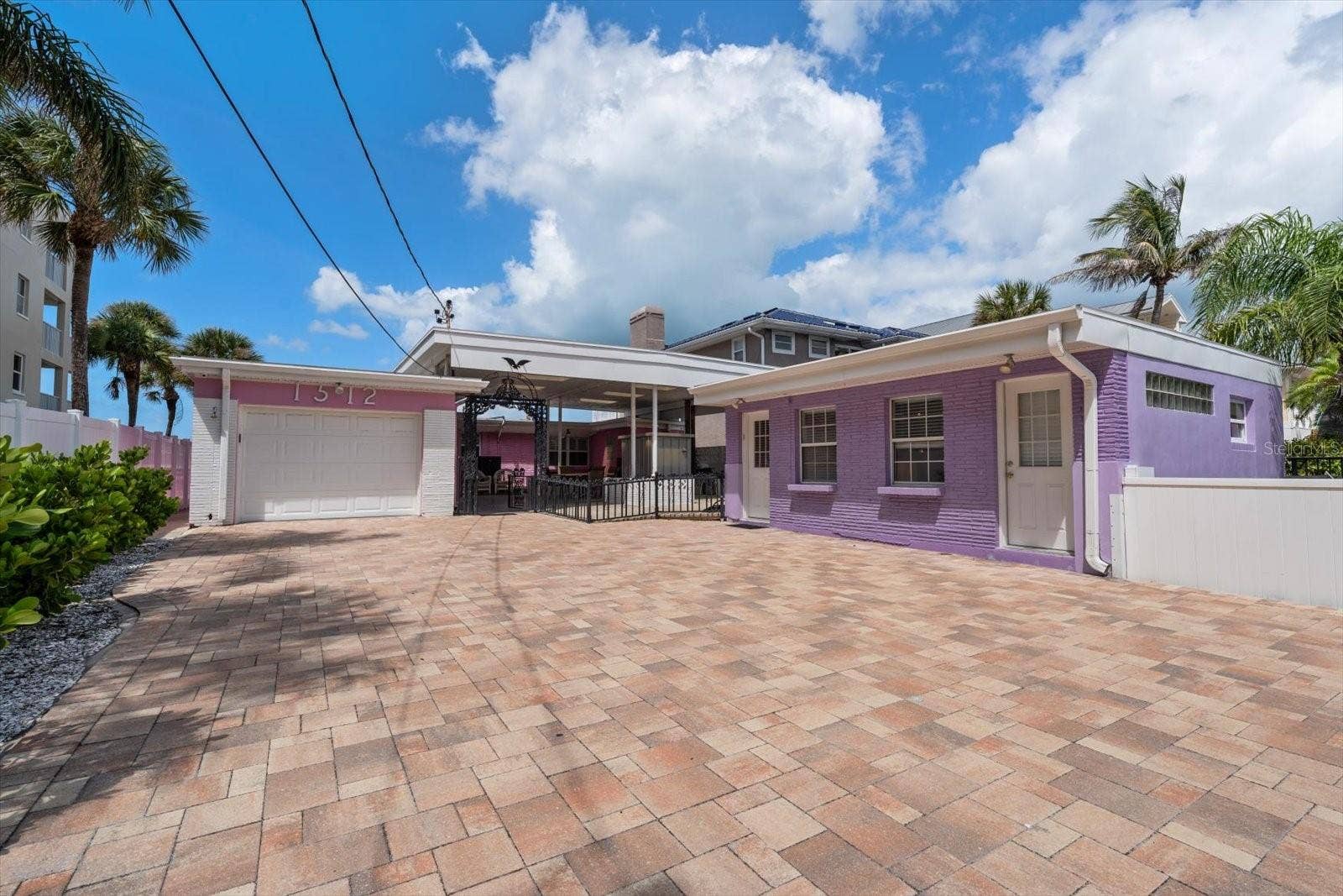 1512 GULF BOULEVARD, Indian Rocks Beach, FL 33785 Colorful and appealing property offering flexibility in use-single family with income potential or redevelopment considering its zoning and size of property.