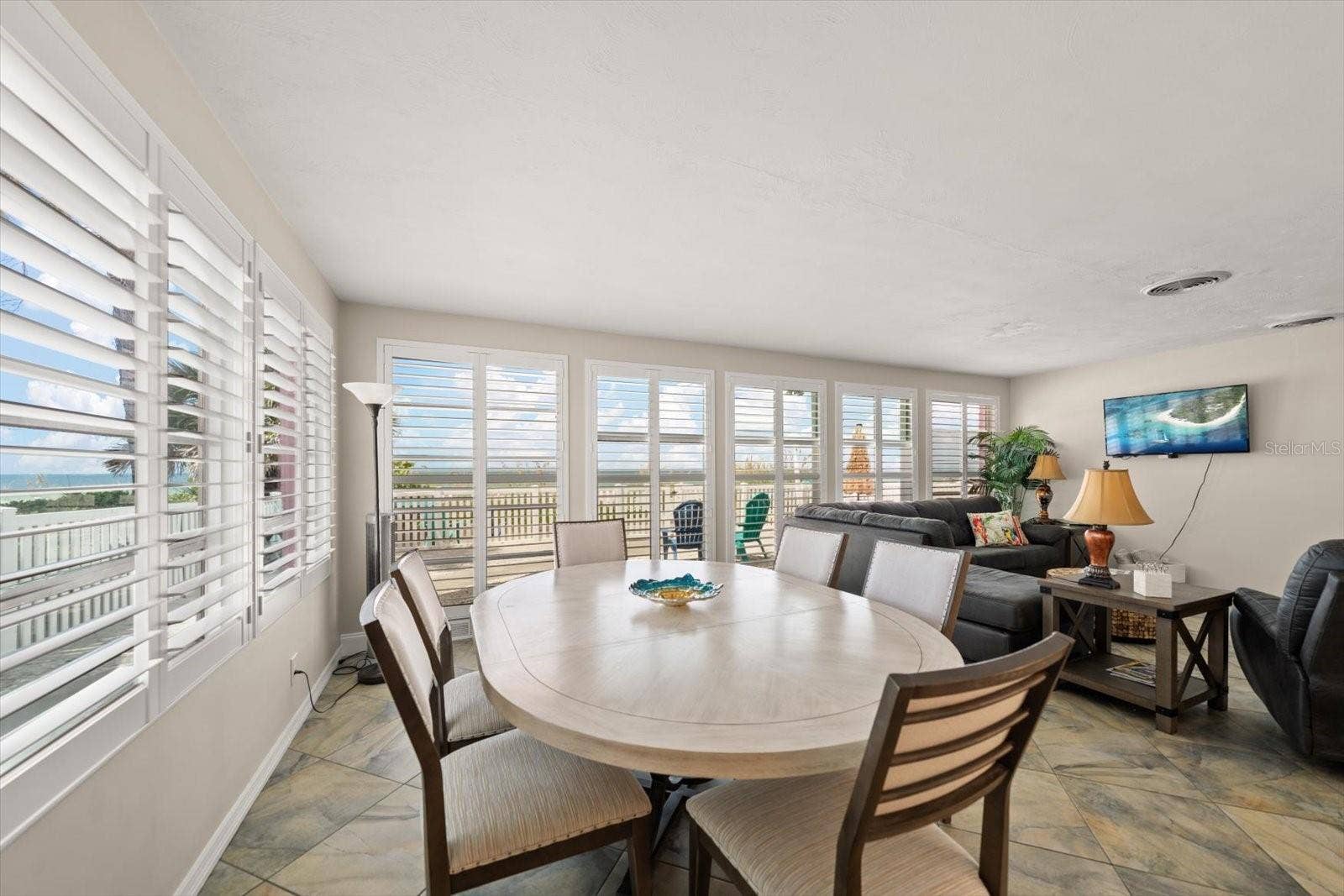 1512 GULF BOULEVARD, Indian Rocks Beach, FL 33785 Main home-dining area with open flow to living room-all enjoy the beach views!