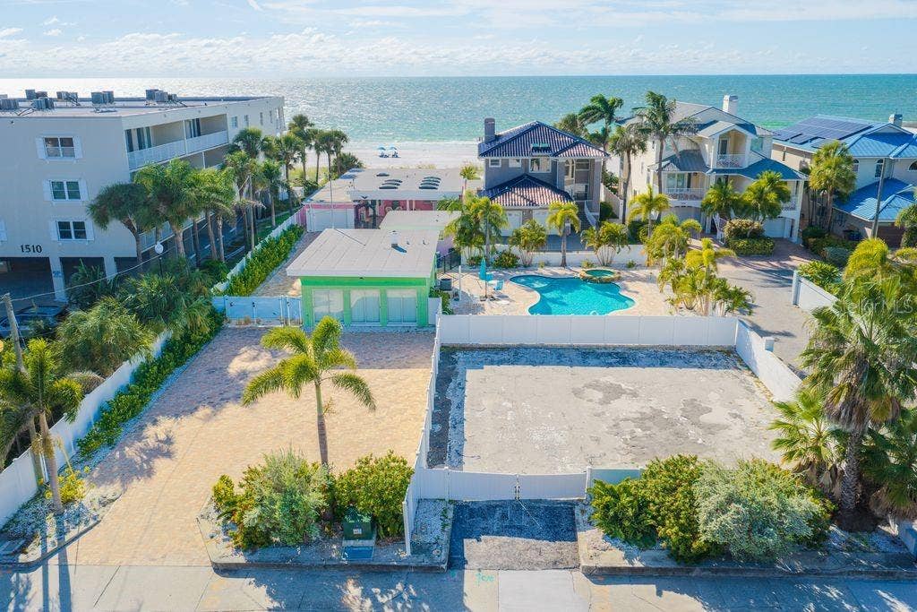 1512 GULF BOULEVARD, Indian Rocks Beach, FL 33785 Abundant parking, huge pool, additional lot-all fenced and very private-imagine the possibilities!