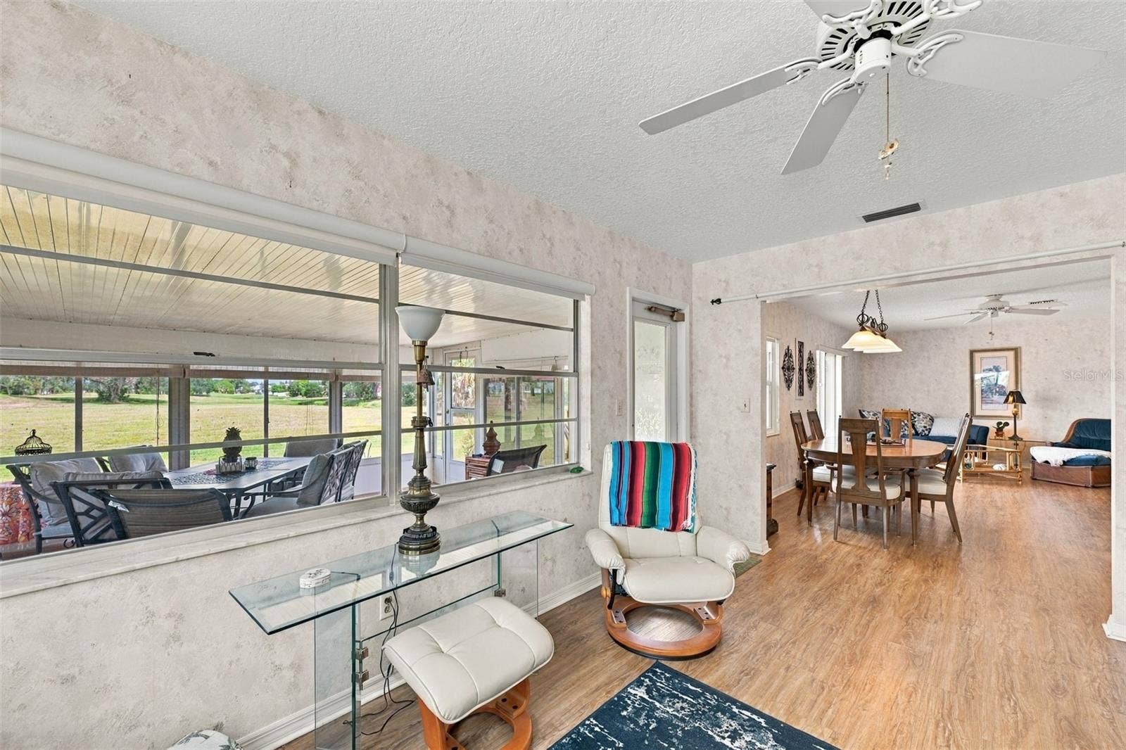 The family room is bright and spacious and opens directly onto the Florida room.