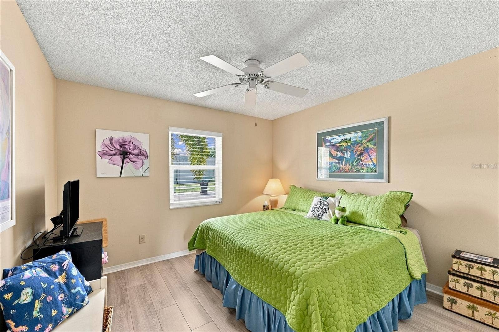 Guest bedroom is bright and comfortable.