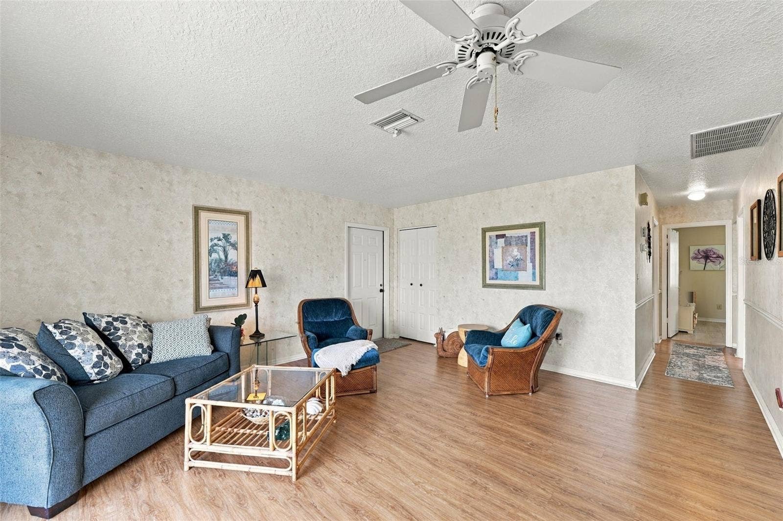 From the living room, the bedrooms and baths are just down the hall.
