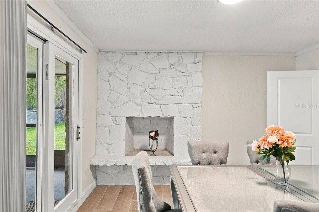 8223 GULF WAY, Hudson, FL 34667 Dining/Living/Fireplace