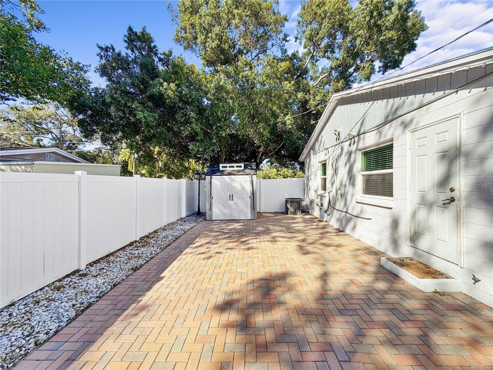 6819 S DESOTO STREET, Tampa, FL 33616 Back paver patio with shed