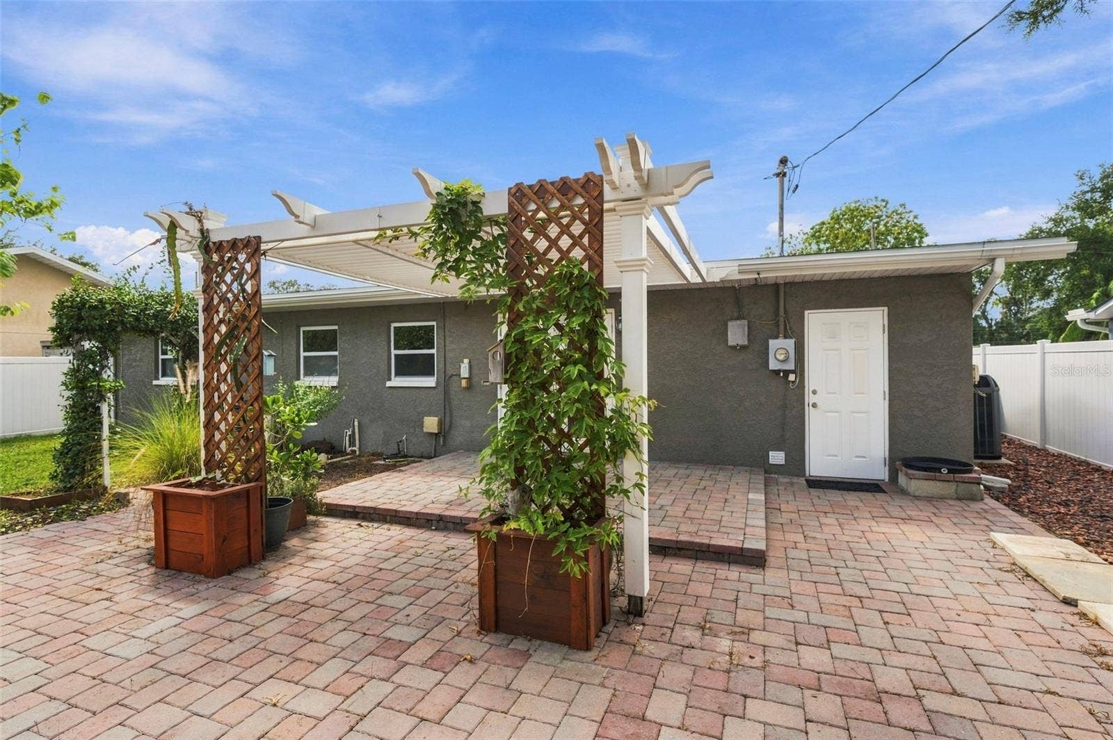 Expansive paver patio with pergola