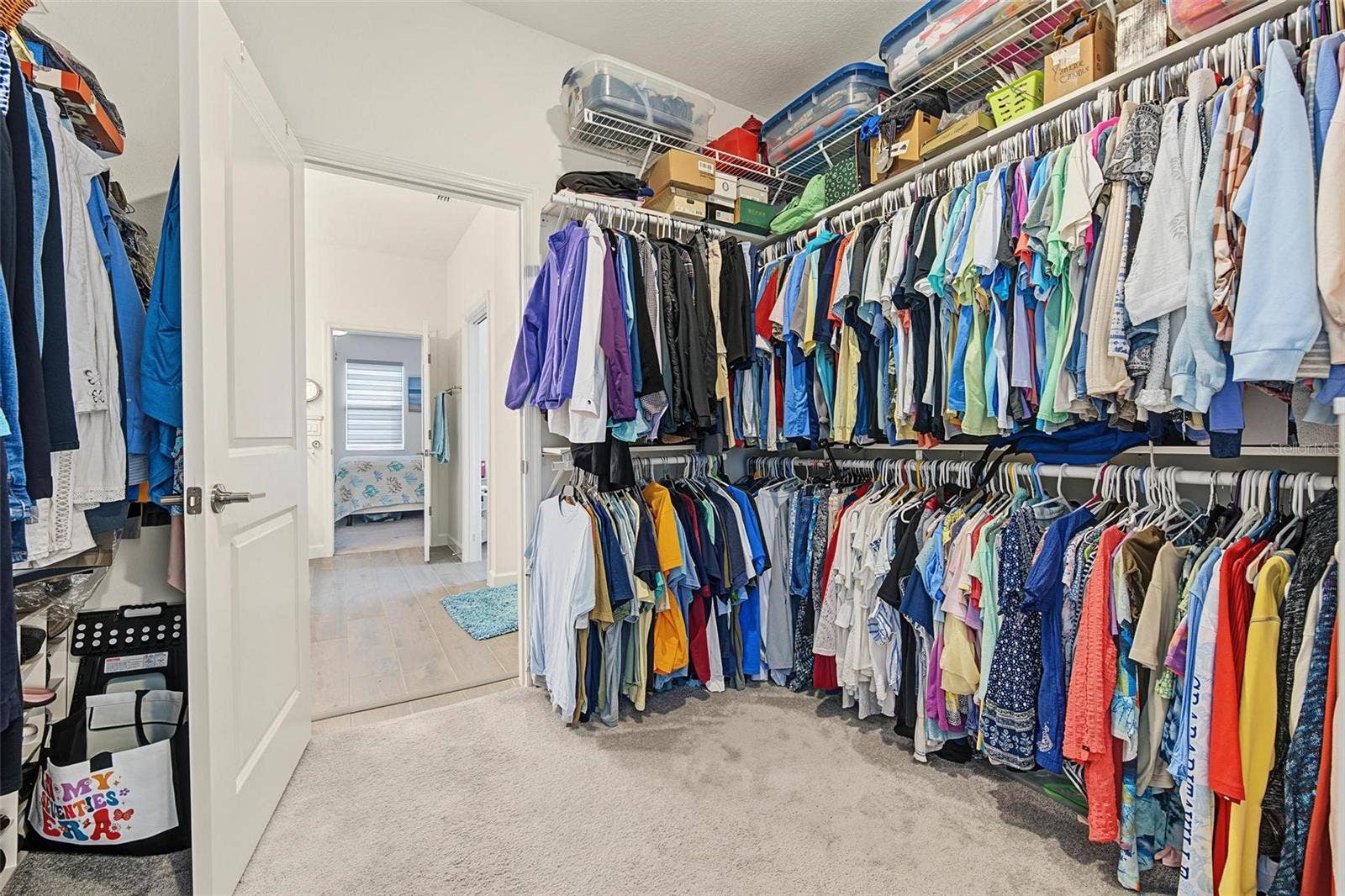 owners closet opens to laundry room and owners bath