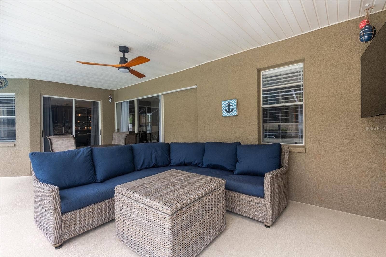 9713 LOMALINDA COURT, New Port Richey, FL 34655 Comfy couch for relaxing on the lanai and the sliders recess open.