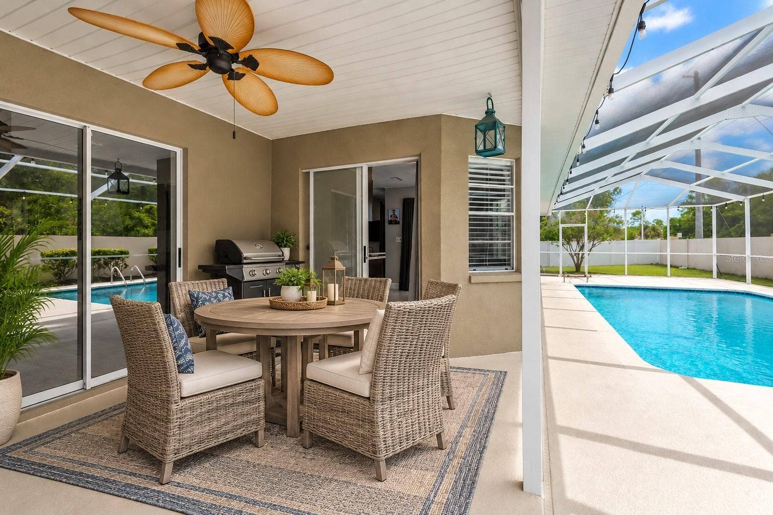 9713 LOMALINDA COURT, New Port Richey, FL 34655 Slider is recessed open for grilling and dining outside.