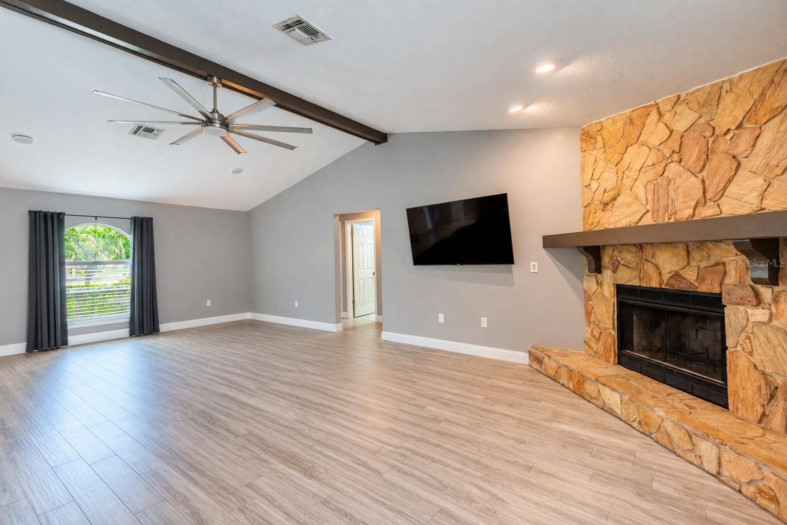 9713 LOMALINDA COURT, New Port Richey, FL 34655 Great room with items virtually removed.