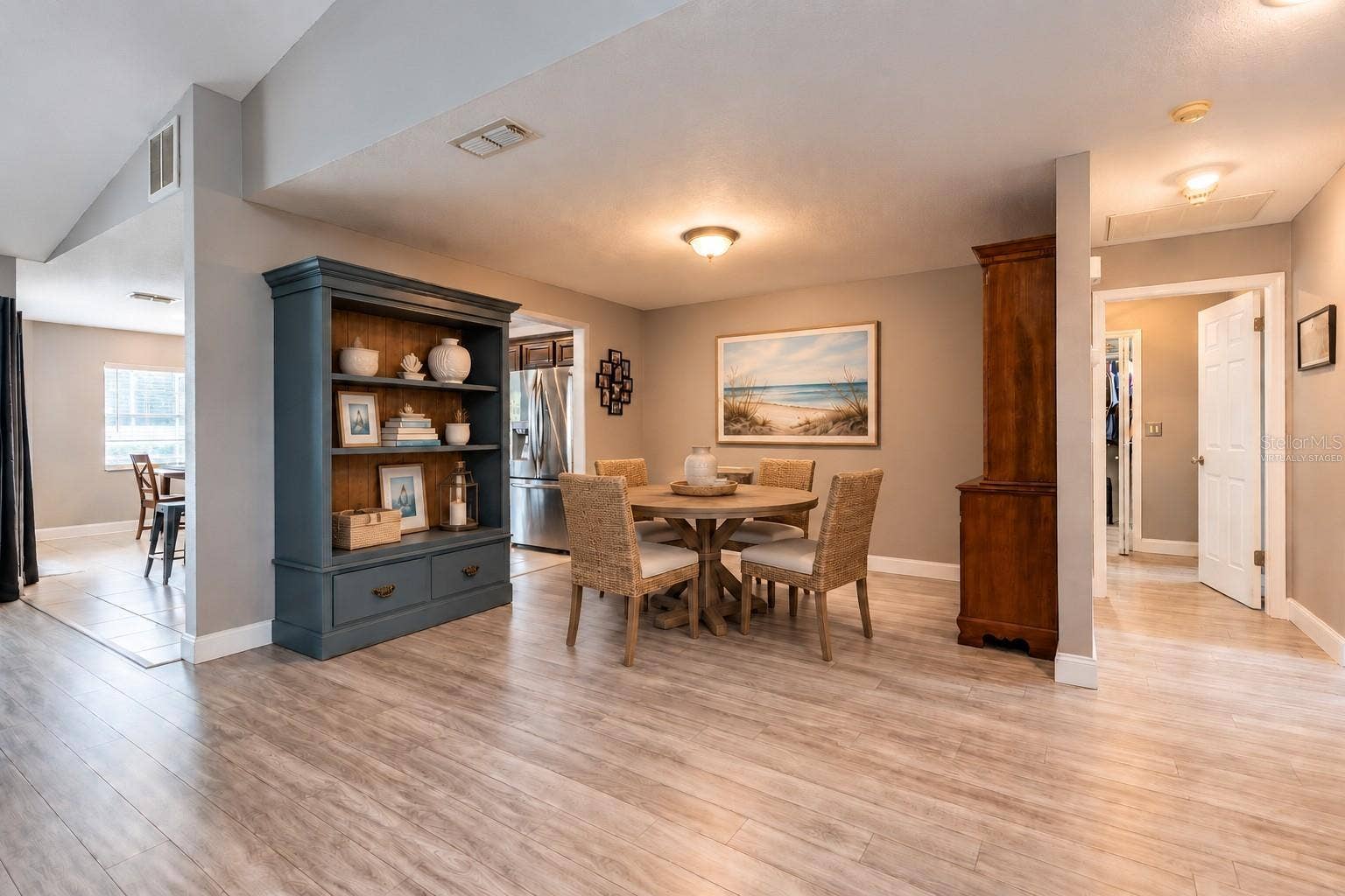 9713 LOMALINDA COURT, New Port Richey, FL 34655 Virtually staged dining area off of the great room, kitchen and the hall leads to the laundry room and secondary bedrooms.