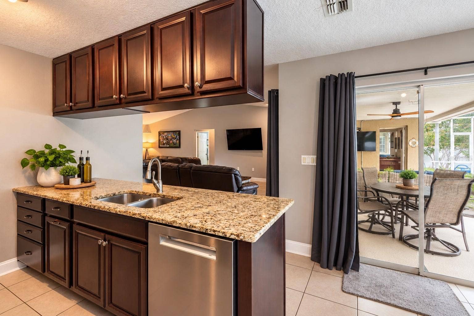9713 LOMALINDA COURT, New Port Richey, FL 34655 Another view of the kitchen with sliders to the lanai.